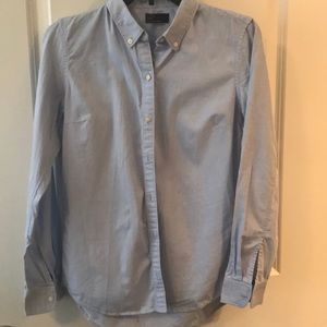 Professional fitted blue button down shirt.